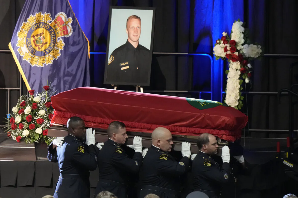 Pallbearers carry the casket of OPP Const. Grzegorz (Greg) Pierzchala following his funeral service at the Sadlon Arena in Barrie, Ont., on Jan. 4, 2023. The killing of Pierzchala in late 2022 by a violent offender out on bail led to calls to reform the bail system. (The Canadian Press/Frank Gunn) 