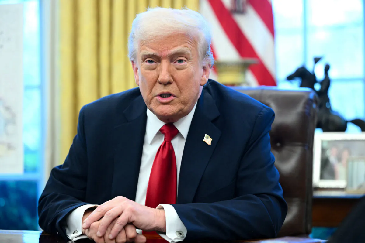 President Donald Trump announces tariffs on auto imports, in the Oval Office of the White House on March 26, 2025. (Mandel Ngan/AFP via Getty Images)