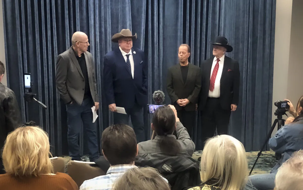 Alberta Prosperity Project CEO Mitch Sylvestre (L) holds a press conference with (L–R) lawyer Jeffrey Rath, Dr. Dennis Modry, and former MP LaVar Payne in Calgary on March 26, 2025. (The Epoch Times)