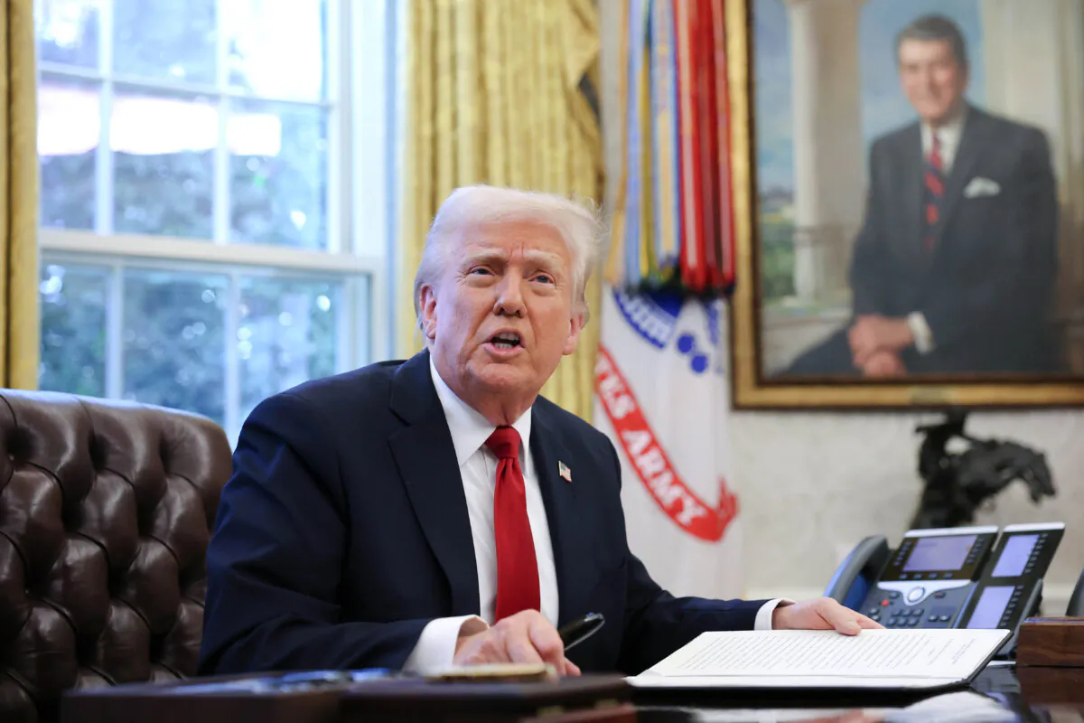 President Donald Trump speaks to reporters before signing an executive order in the Oval Office of the White House on March 26, 2025. (Win McNamee/Getty Images)