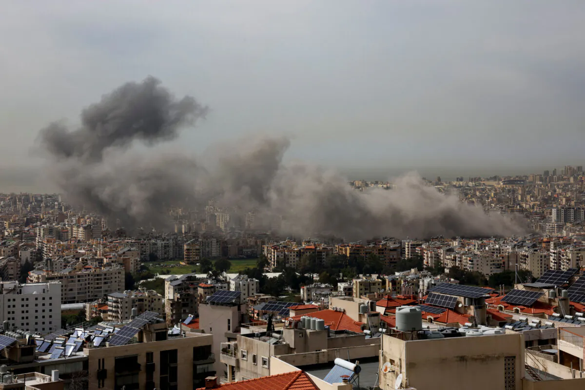 Smoke billows over Beirut's southern suburbs following an Israeli strike, as seen from Baabda, Lebanon, on March 28, 2025. (Mohamed Azakir/Reuters)