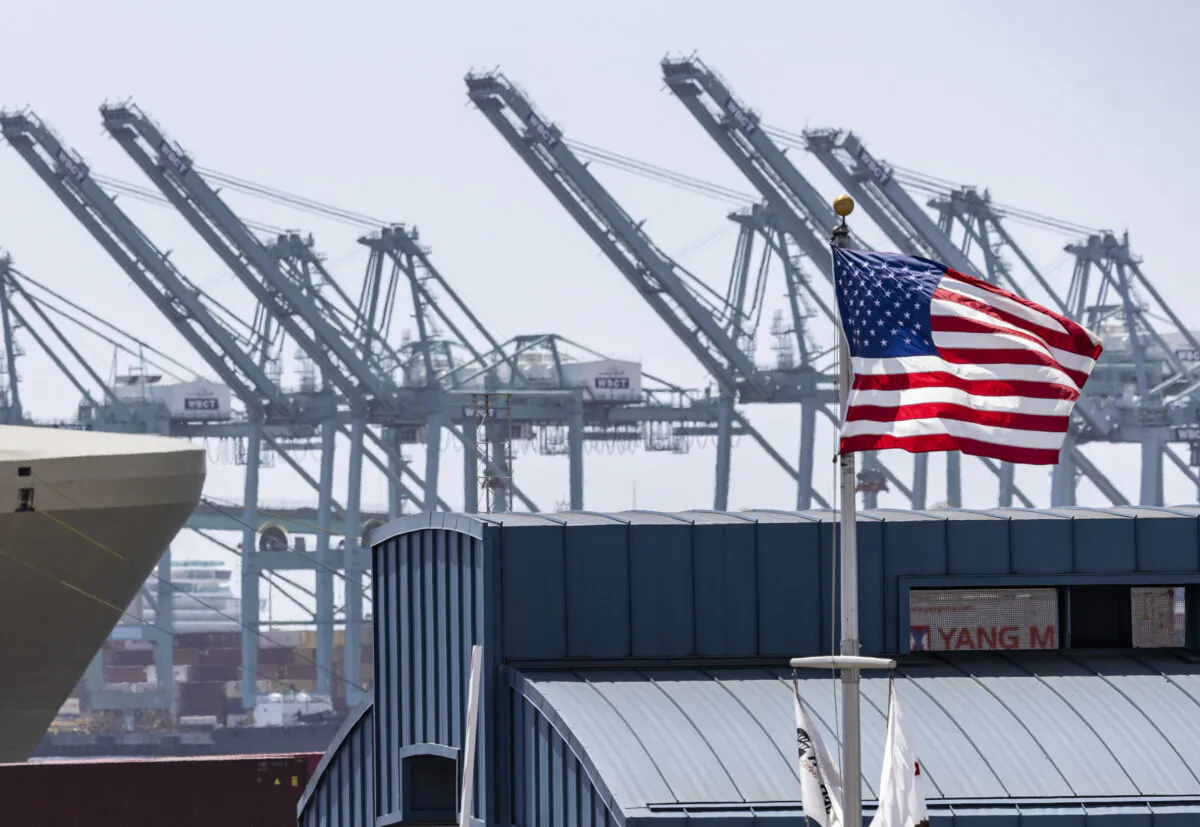 An American flag blows in the wind near the Port of Los Angeles on March 28, 2025. (John Fredricks/The Epoch Times)