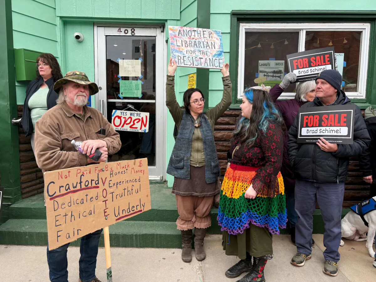 Supporters of Susan Crawford, the Democrat-backed candidate for the Wisconsin Supreme Court, demonstrate on the streets of Eau Claire, Wis., on March 26, 2025. (Nathan Worcester/The Epoch Times)