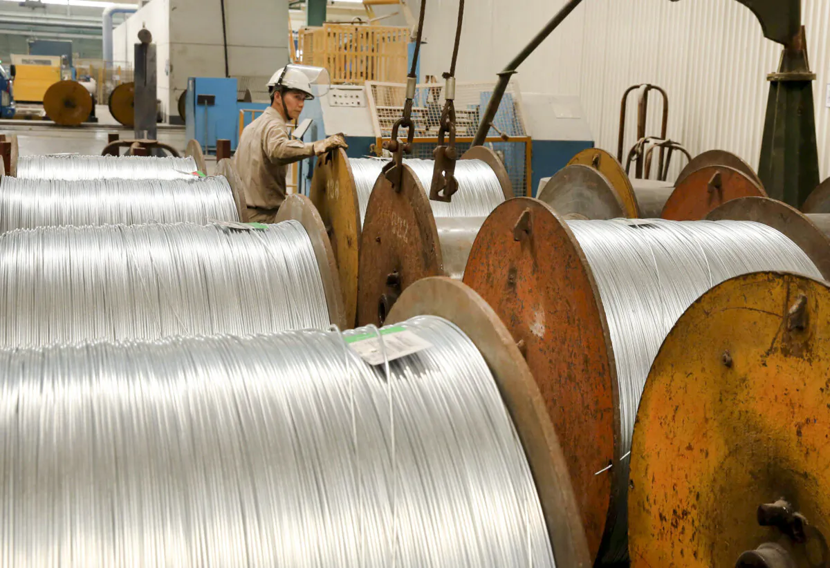A worker handles steel cables at a steel factory in Nantong, eastern Jiangsu Province, China, on July 3, 2018. (AFP/Getty Images)