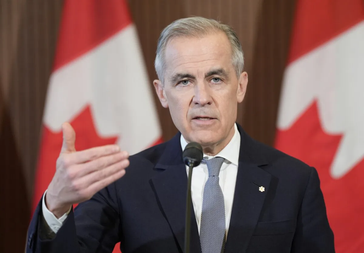 Liberal Leader Mark Carney speaks with media on Parliament Hill following a meeting of the Cabinet Committee on Canada-U.S. Relations and National Security in Ottawa on March 27, 2025. (THE CANADIAN PRESS/Adrian Wyld)