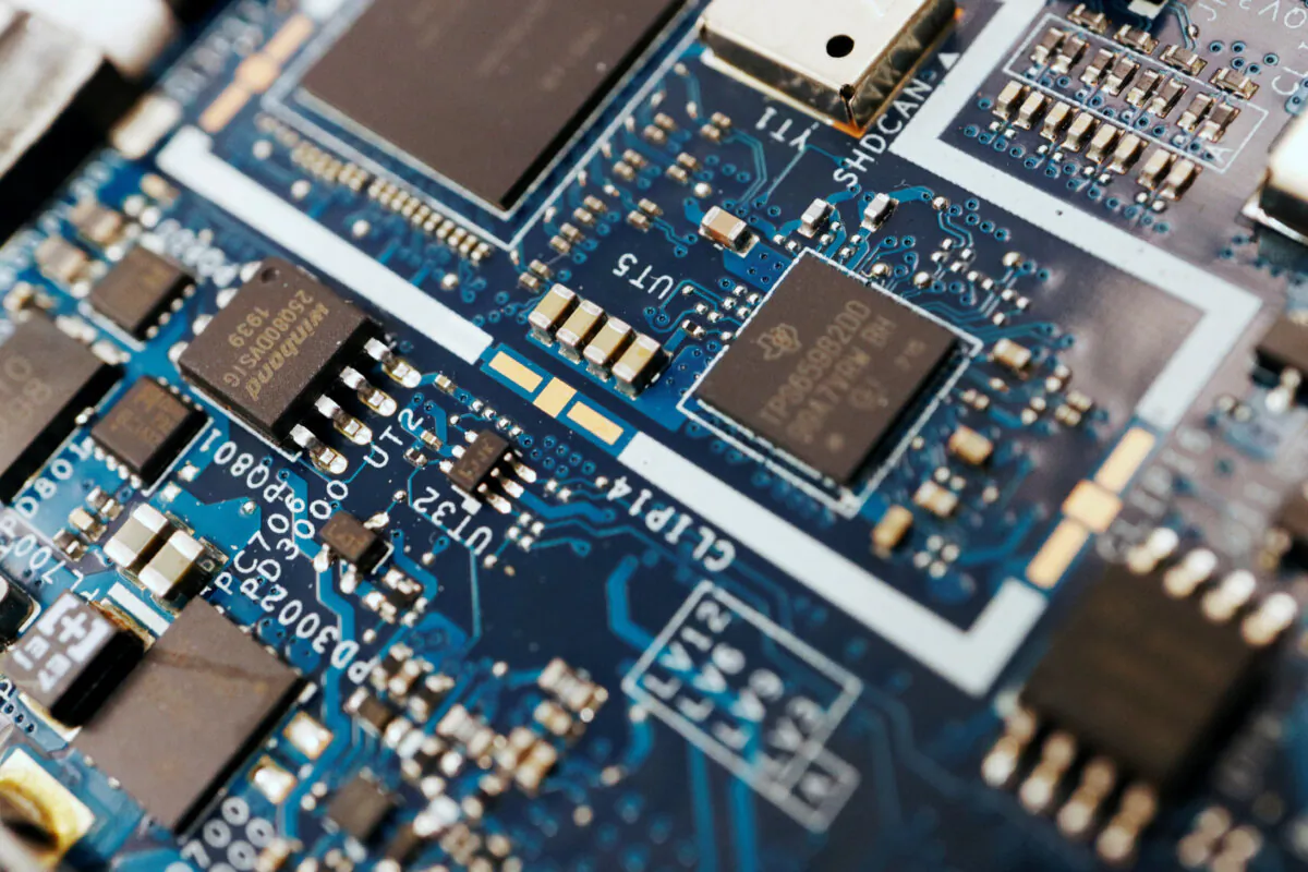 Semiconductor chips are seen on a circuit board of a computer in this illustration picture taken Feb. 25, 2022. (Florence Lo/Reuters)