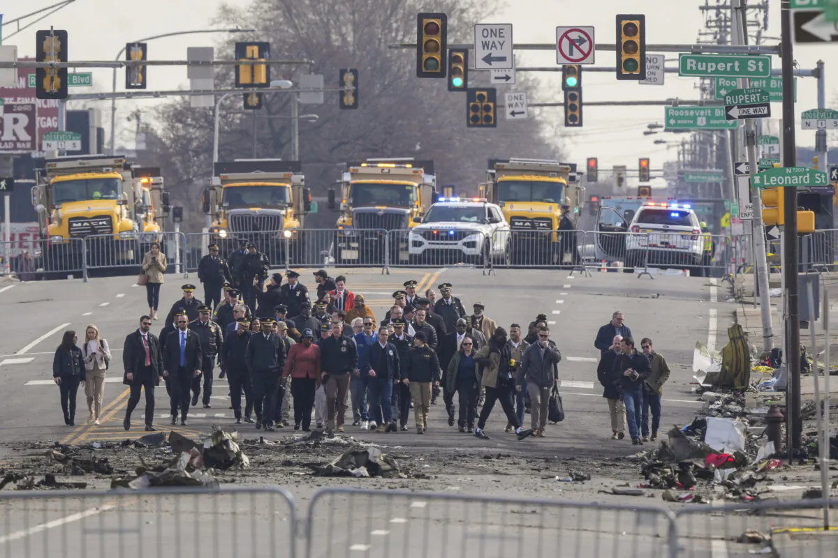 Pennsylvania Gov. Josh Shapiro, Philadelphia Mayor Cherelle Parker and other officials view the aftermath of a fatal small plane crashed in Philadelphia on Feb. 3, 2025. (Matt Rourke/AP Photo)