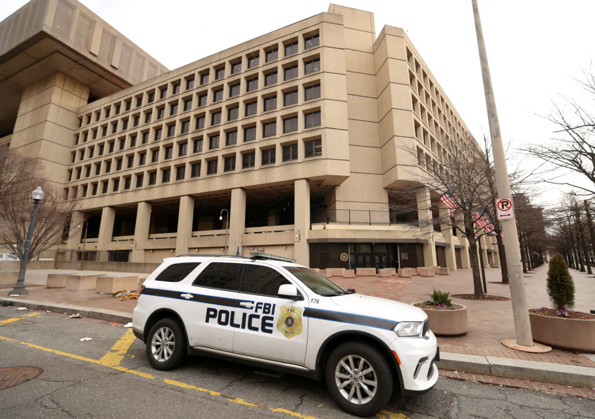 An FBI police car stands outside FBI headquarters in Washington on Feb. 3, 2025. (Kevin Lamarque/Reuters)
