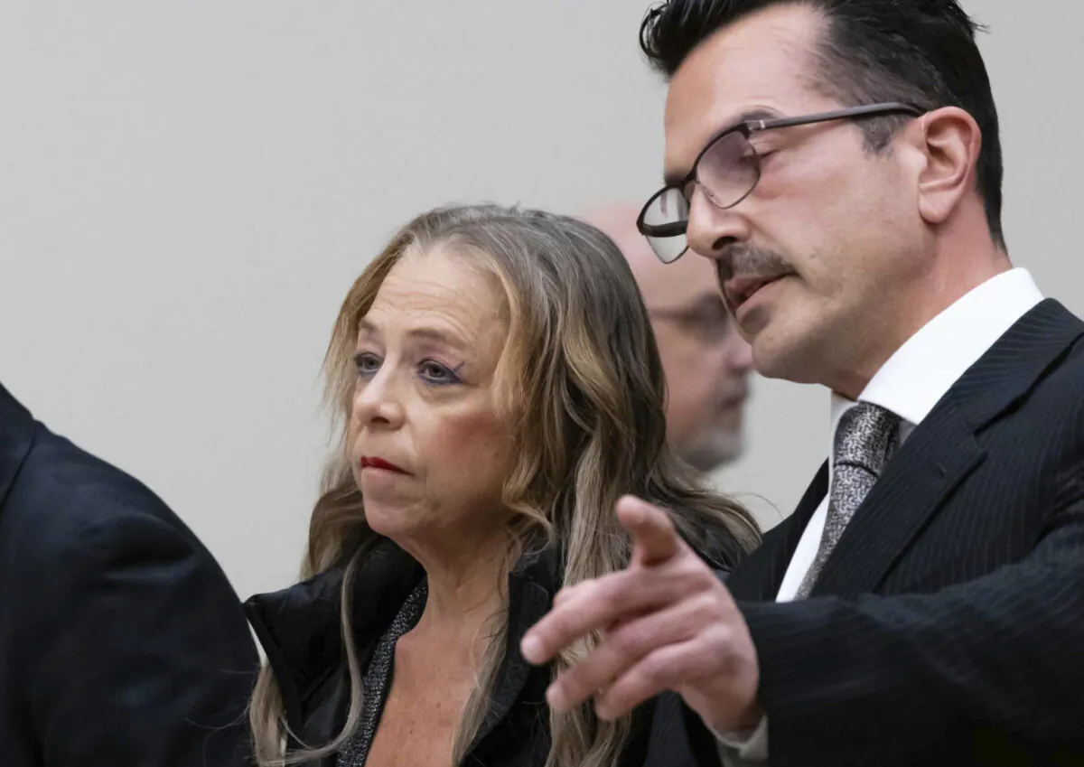 Kim Sullivan stands with her attorney Ioannis Kaloidis, (R), during her arraignment at Waterbury Superior Court in Waterbury, Conn., on March 12, 2025. (Jim Shannon/Pool/Hearst Connecticut Media via AP)