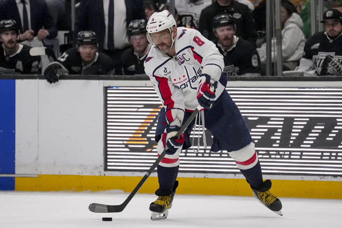 Washington Capitals left wing Alex Ovechkin (8) passes the puck during the third period of an NHL hockey game against the Los Angeles Kings in Los Angeles, on Thursday, March 13, 2025. (Eric Thayer /AP Photo)