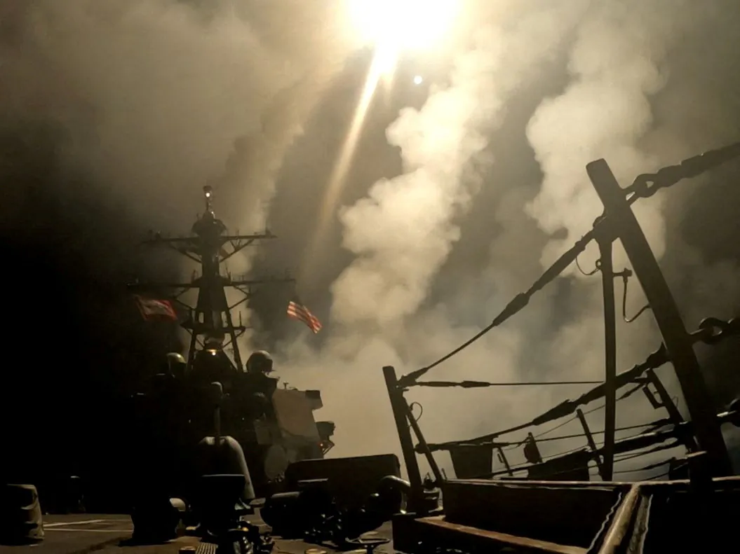 A ship fires missiles at an undisclosed location, after U.S. President Donald Trump launched military strikes against Yemen's Iran-aligned Houthis on Saturday over the group's attacks against Red Sea shipping, in this screengrab obtained from a handout video released on March 15, 2025. (U.S. Central Command/Handout via Reuters)