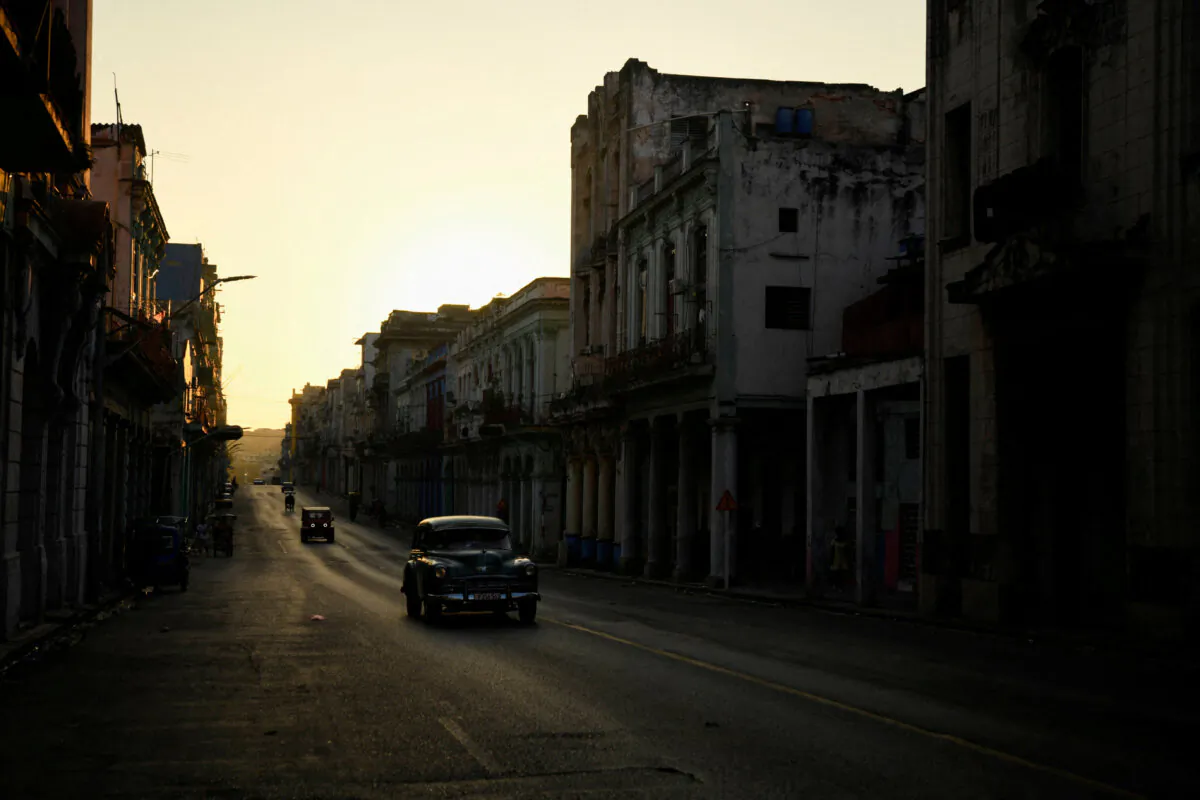 Cars drive on a street during a national electrical grid collapse, in Havana, Cuba, on March 15, 2025. (Norlys Perez/Reuters)