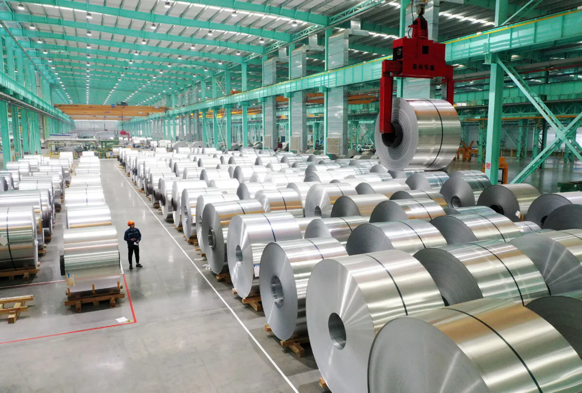 A drone view shows an employee working on the production line of aluminium products at a factory in Huaibei, Anhui Province, China, on Feb. 11, 2025. (China Daily via Reuters)