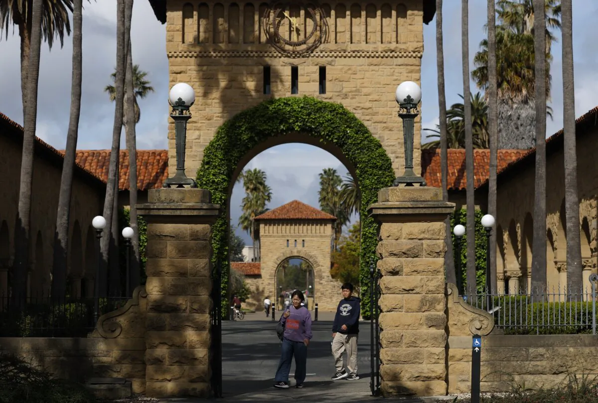 People walk on the Stanford University campus in Stanford, Calif., on March 28, 2025. (Justin Sullivan/Getty Images)