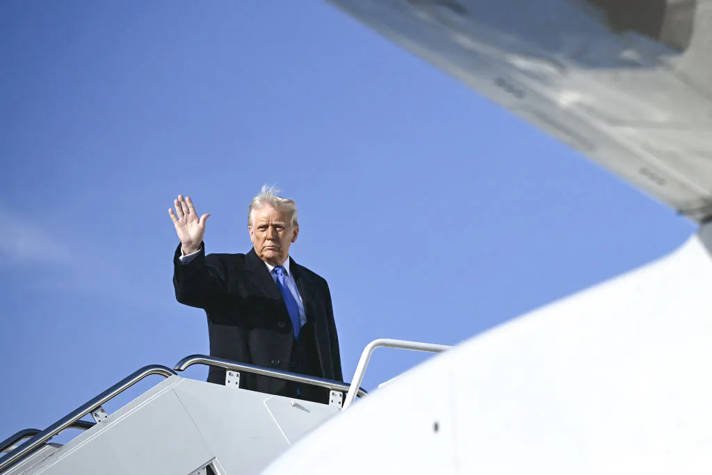 President Donald Trump waves as he boards Air Force One at Joint Base Andrews, Md., on March 21, 2025. (BRENDAN SMIALOWSKI/AFP via Getty Images)