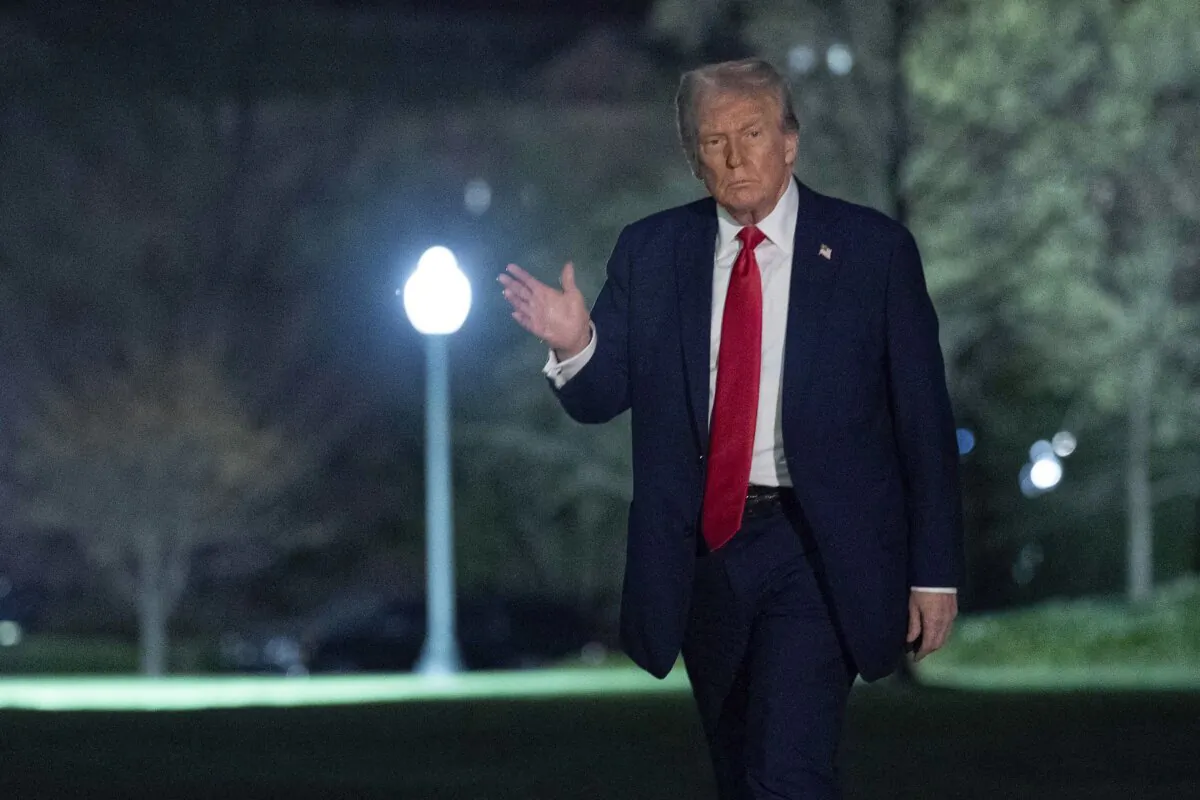President Donald Trump waves to the media as he walks on the South Lawn of the White House in Washington on March 30, 2025. (The Canadian Press/AP, Jose Luis Magana)