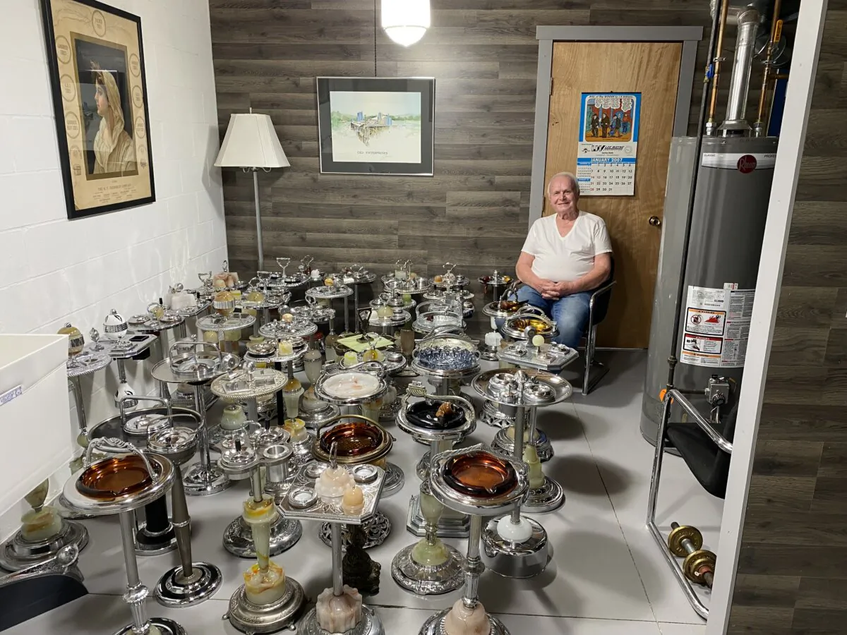 Epoch Times reader Joe Nemes, owner of Nemes Machine in Akron, Ohio, displays his collection of smoking stands in his basement workshop. (Courtesy of Denise Bench)