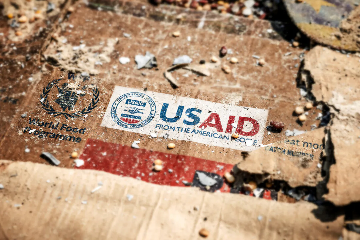 A U.S. Agency for International Development logo is visible on a box amid the scattered remains of boxes and materials left behind by looters after widespread vandalism and looting following clashes at the World Food Programme warehouse in Bukavu, Democratic Republic of the Congo, on Feb. 21, 2025. (Luis Tato/AFP via Getty Images)