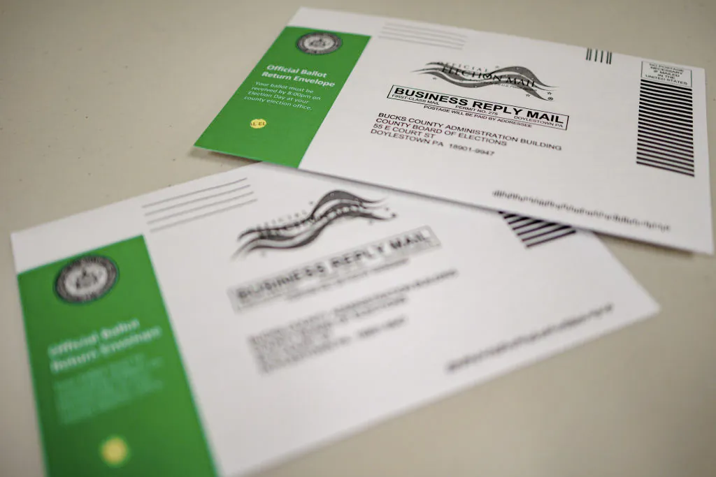 Mail-in ballots are displayed during a processing demonstration at the Board of Elections office in Doylestown, Pa., on Sept. 30, 2024. (Photo illustration by Hannah Beier/Getty Images)