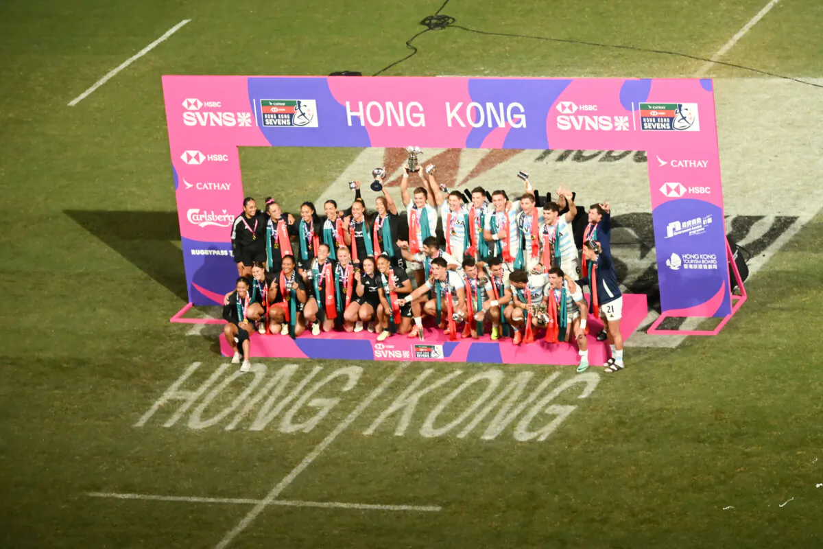 The New Zealand women’s and Argentina men’s teams celebrate winning the Hong Kong Rugby Sevens tournament at the new Kai Tak Stadium in Hong Kong on Sunday, March 30. (Bill Cox/The Epoch Times) 