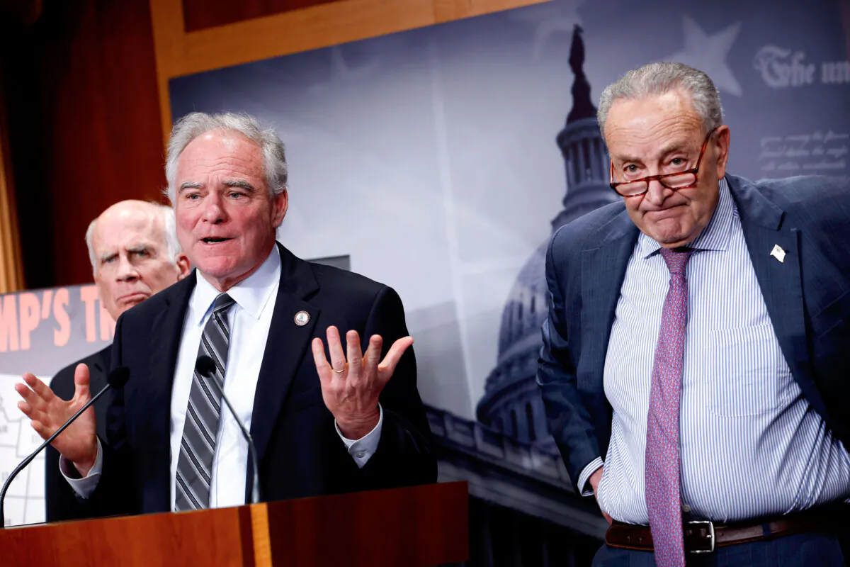 Sen. Tim Kaine (D-Va.) (C) speaks alongside Senate Minority Leader Charles Schumer (D-N.Y.) (R) and Sen. Peter Welch (D-Vt.) at a press conference at the U.S. Capitol in Washington on April 2, 2025. (Kevin Dietsch/Getty Images)