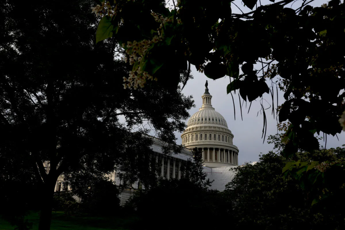 The sun rises behind the U.S. Capitol Building, in a file photo. (Anna Moneymaker/Getty Images)