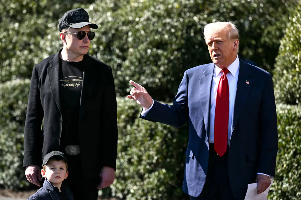 President Trump and Tesla CEO Elon Musk, alongside Musk's son X Æ A-Xii, speak to the press as they stand next to a Tesla vehicle on the South Portico of the White House on March 11, 2025. (Mandel Ngan/AFP via Getty Images)