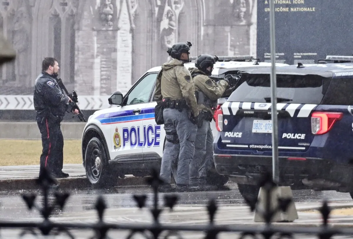Members of the Ottawa police service investigate an incident at Parliament Hill in Ottawa on April 5, 2025. (The Canadian Press/Spencer Colby)