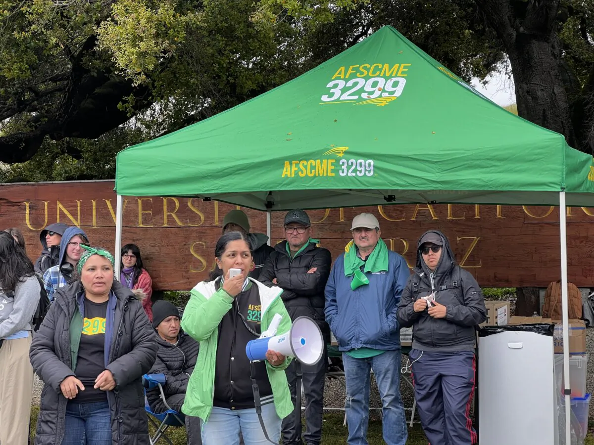 A union member addresses the crowd during a strike outside the entrance of UC–Santa Cruz on April 1, 2025. (Conner Lee/The Epoch Times)