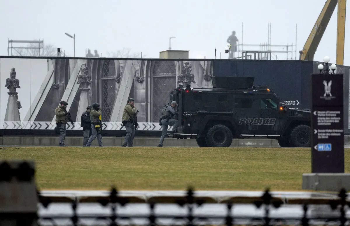 Tactical police officers attend an incident at East Block on Parliament Hill in Ottawa, on April 5, 2025. (The Canadian Press/Justin Tang)