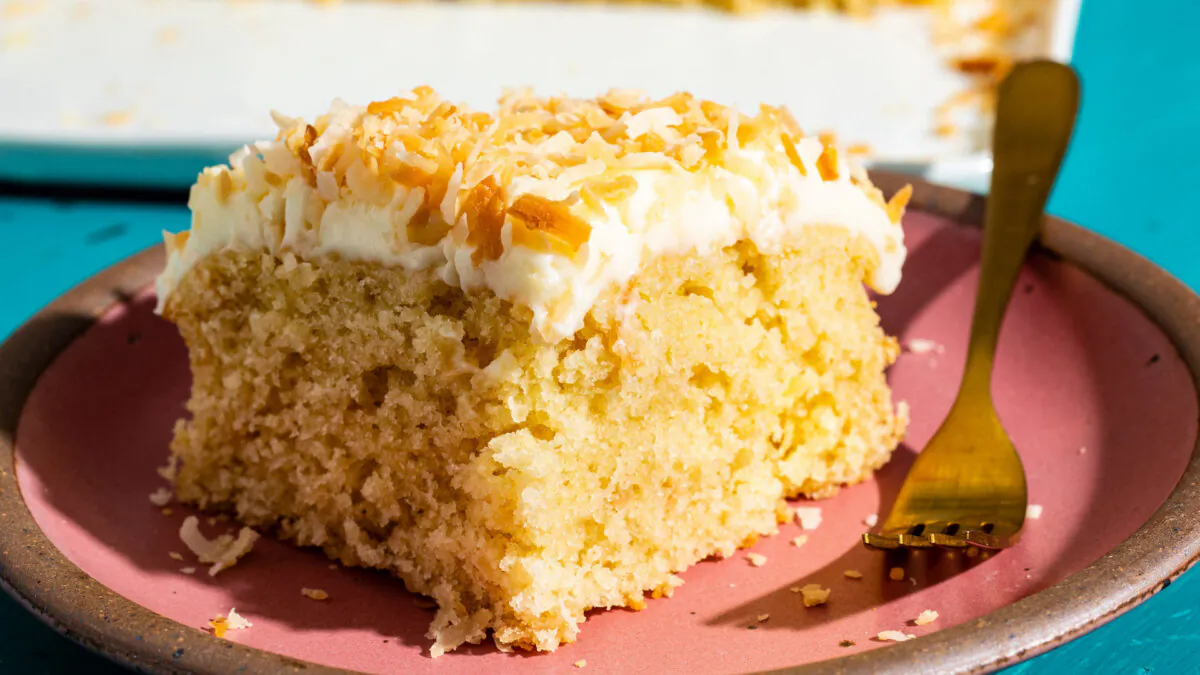 Shredded coconut, cream of coconut, and coconut extract make a cake that's layered with flavor. (Steve Klise/TCA)