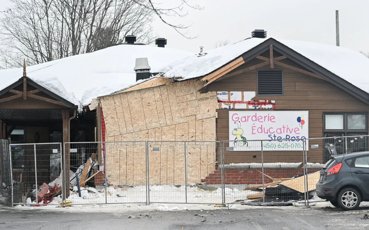 The scene outside a daycare centre in Laval, Que, on Feb. 9, 2023, where a bus crashed into the building killing two children. (The Canadian Press/Graham Hughes) 