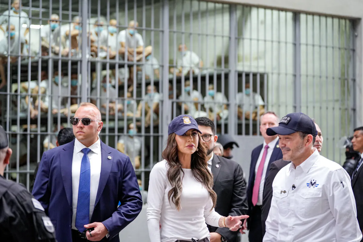 Department of Homeland Security Secretary Kristi Noem, accompanied by Minister of Justice and Public Security Héctor Gustavo Villatoro (R), tours the Terrorist Confinement Center (CECOT) in Tecoluca, El Salvador, on March 26, 2025. (Alex Brandon-Pool/Getty Images)