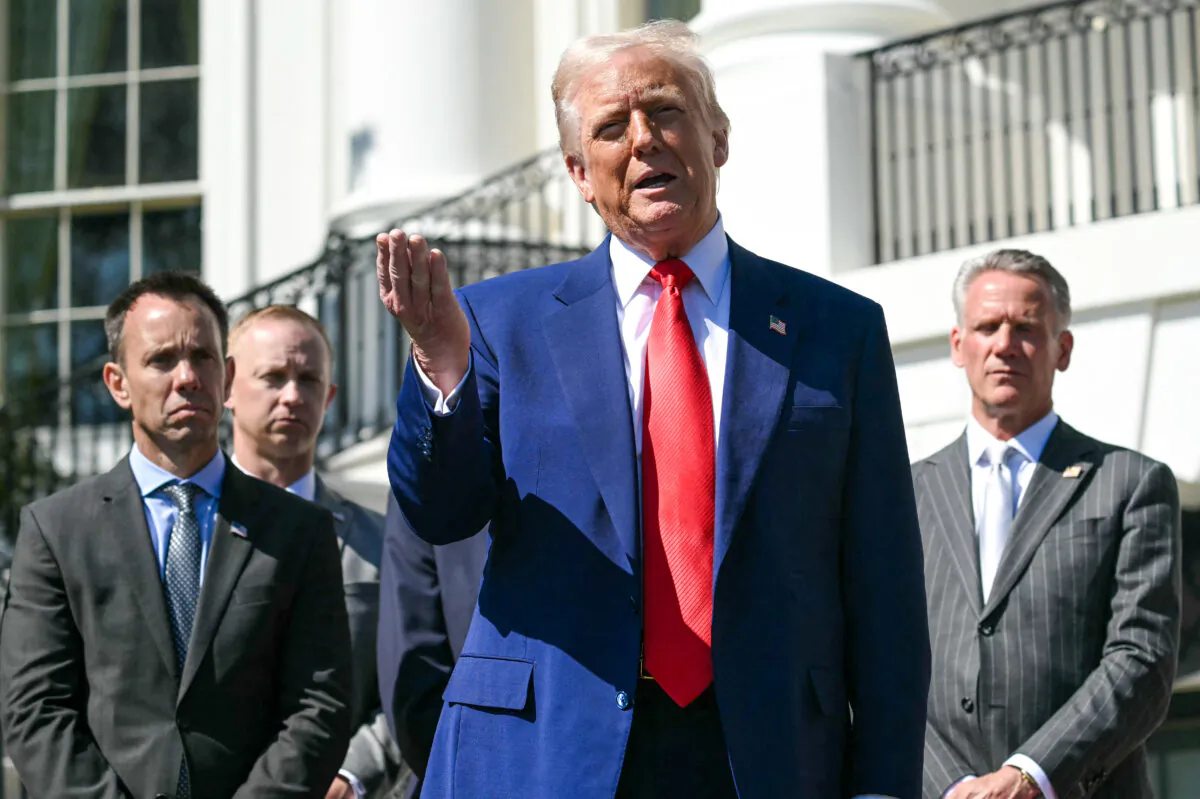 President Donald Trump speaks during a photo opportunity with auto racing officials and champions on the South Portico of the White House on April 9, 2025. (Saul Loeb/AFP via Getty Images)