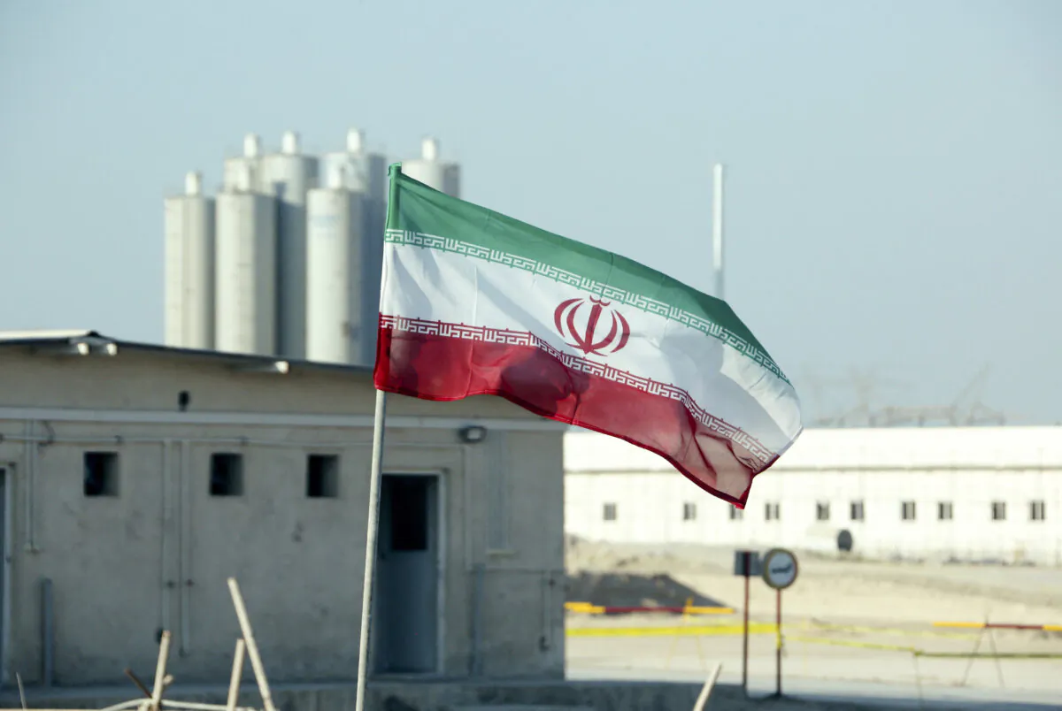 An Iranian flag at Iran's Bushehr nuclear plant during an official ceremony to kickstart work on a second reactor at the country's only nuclear power station on Nov. 10, 2019. (Atta Kenare/AFP via Getty Images)