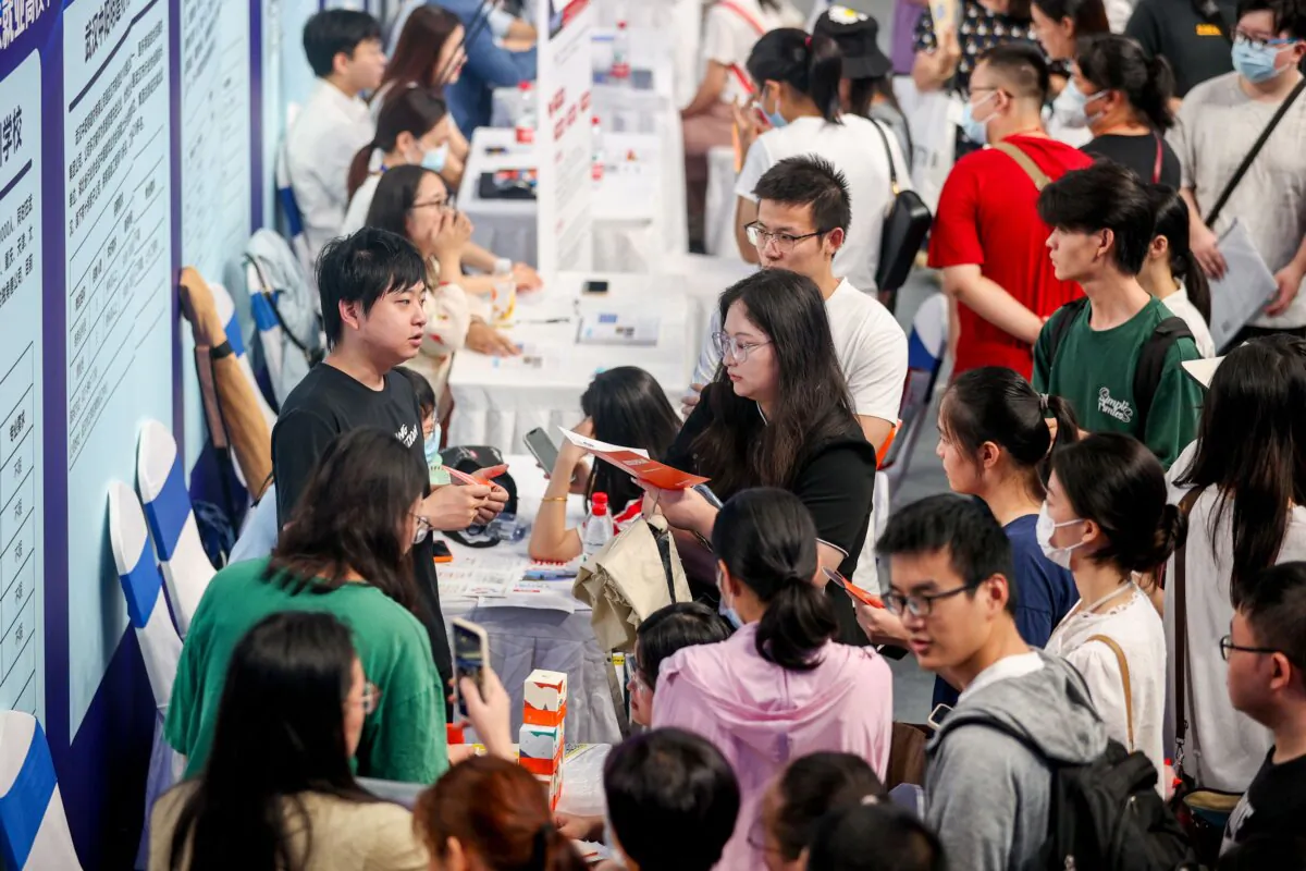 University graduates attend a job fair in Wuhan, central Hubei Province, China, on Aug. 10, 2023. (STR/AFP via Getty Images)