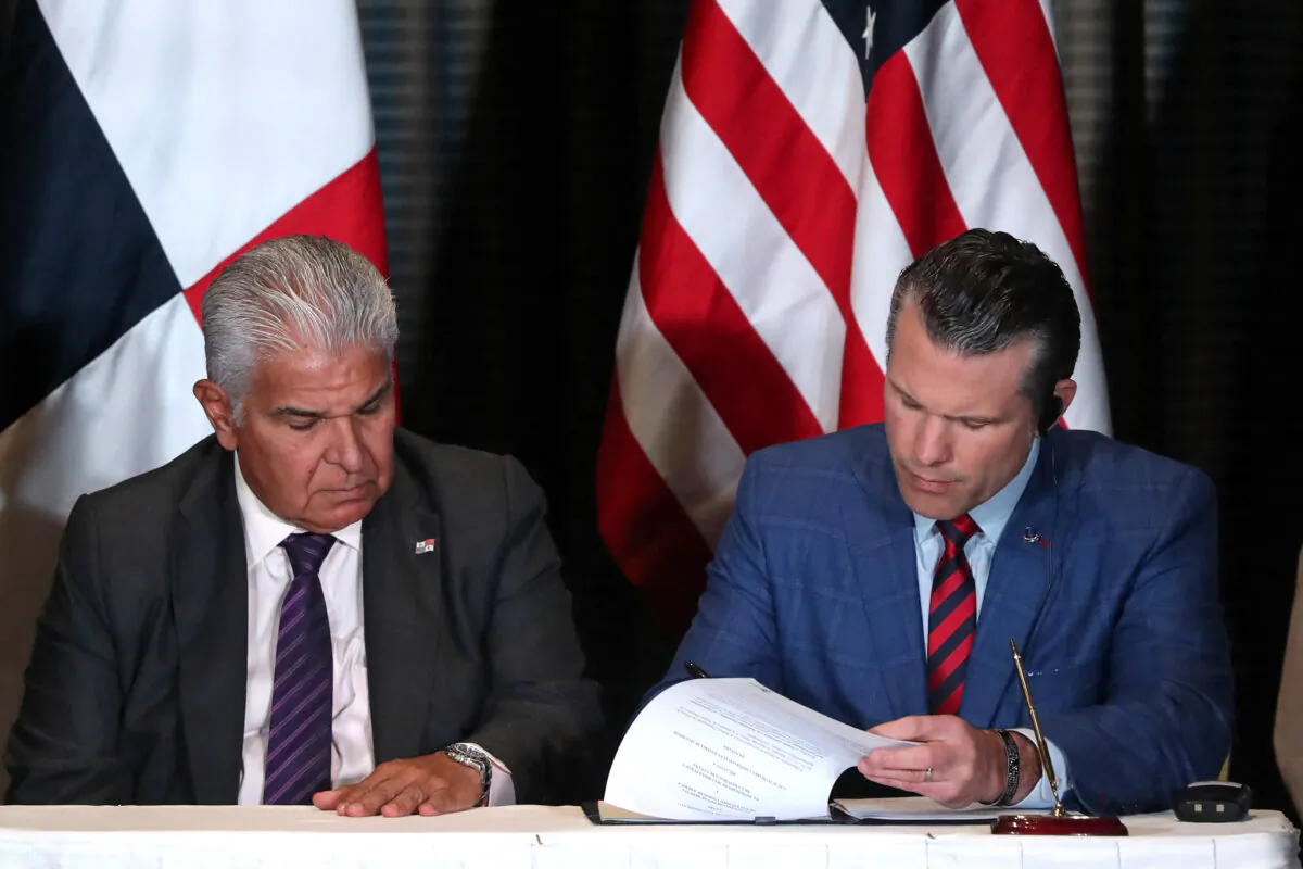 Panama's President Jose Raul Mulino looks on as U.S. Secretary of Defense Pete Hegseth (R) signs a bilateral agreement, in Panama City on April 9, 2025. (Franco Brana/AFP via Getty Images)