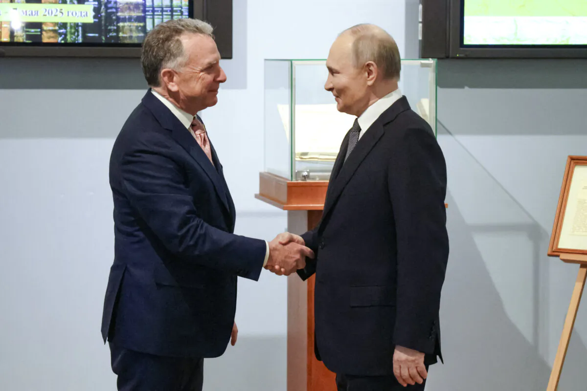 Russia's President Vladimir Putin shakes hands with U.S. President Donald Trump's envoy Steve Witkoff (L) during a meeting in Saint Petersburg, Russia, on April 11, 2025. (Gavriil Grigorov/Pool/AFP via Getty Images)