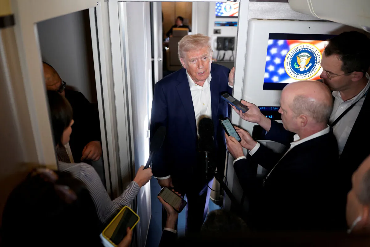 President Donald Trump speaks to the media aboard Air Force One on the way to Palm Beach International Airport, West Palm Beach, Fla., on April 11, 2025. (Nathan Howard/Reuters)