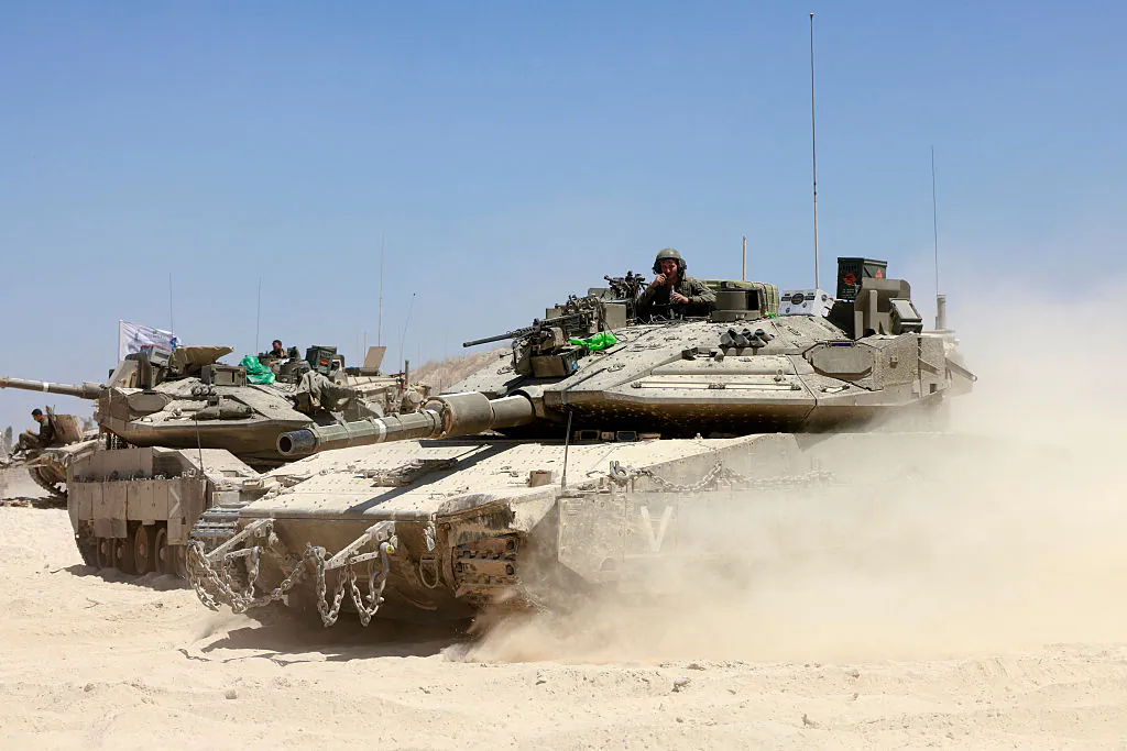 Israeli troops deploy at a position near Israel's border with the Gaza Strip, on May 8, 2025 amid the ongoing war between Israel and the Palestinian militant movement Hamas. (Menahem Kahana/ AFP/Getty Images)