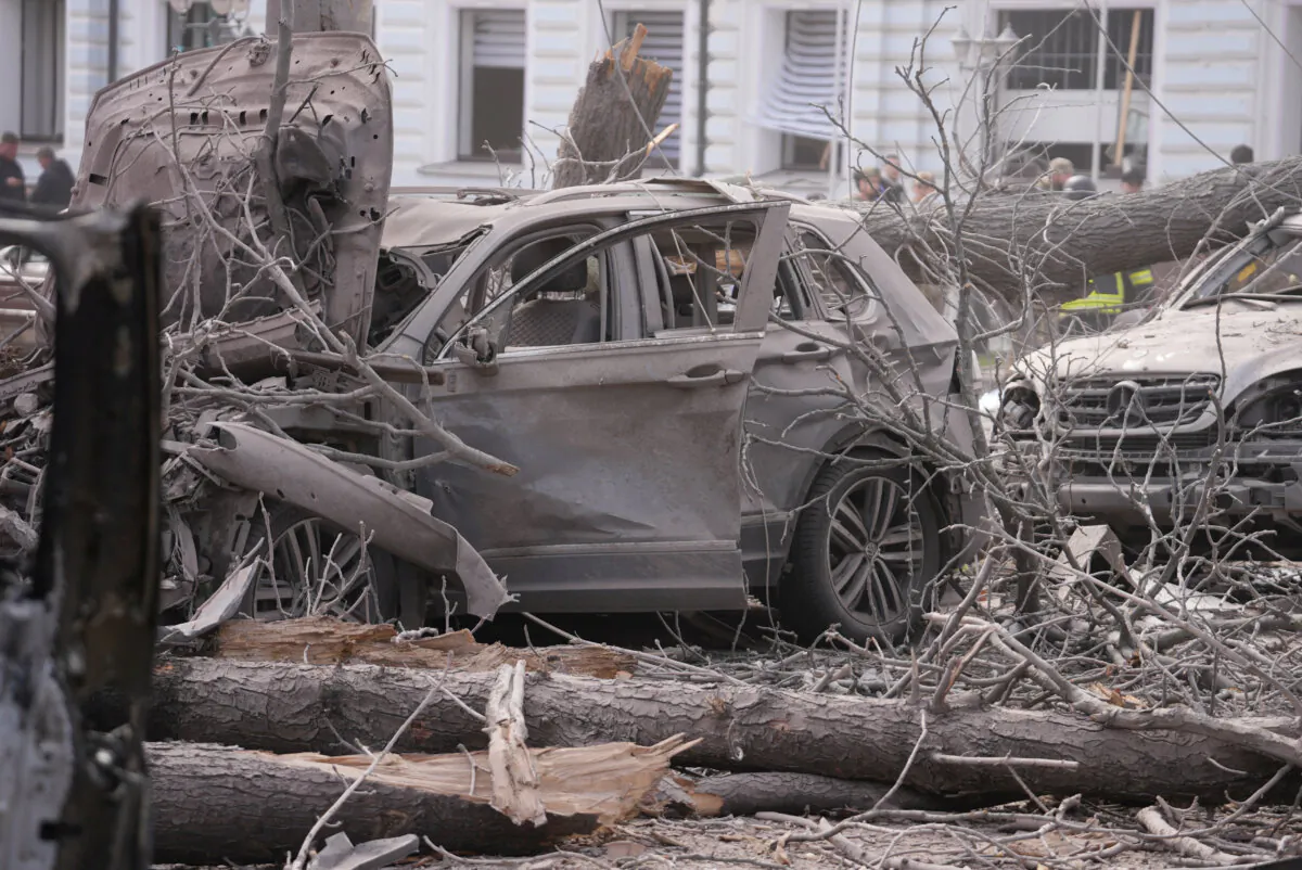 Damaged vehicles at the site of a Russian missile strike, in Sumy, Ukraine, on April 13, 2025. (Stringer/Reuters)