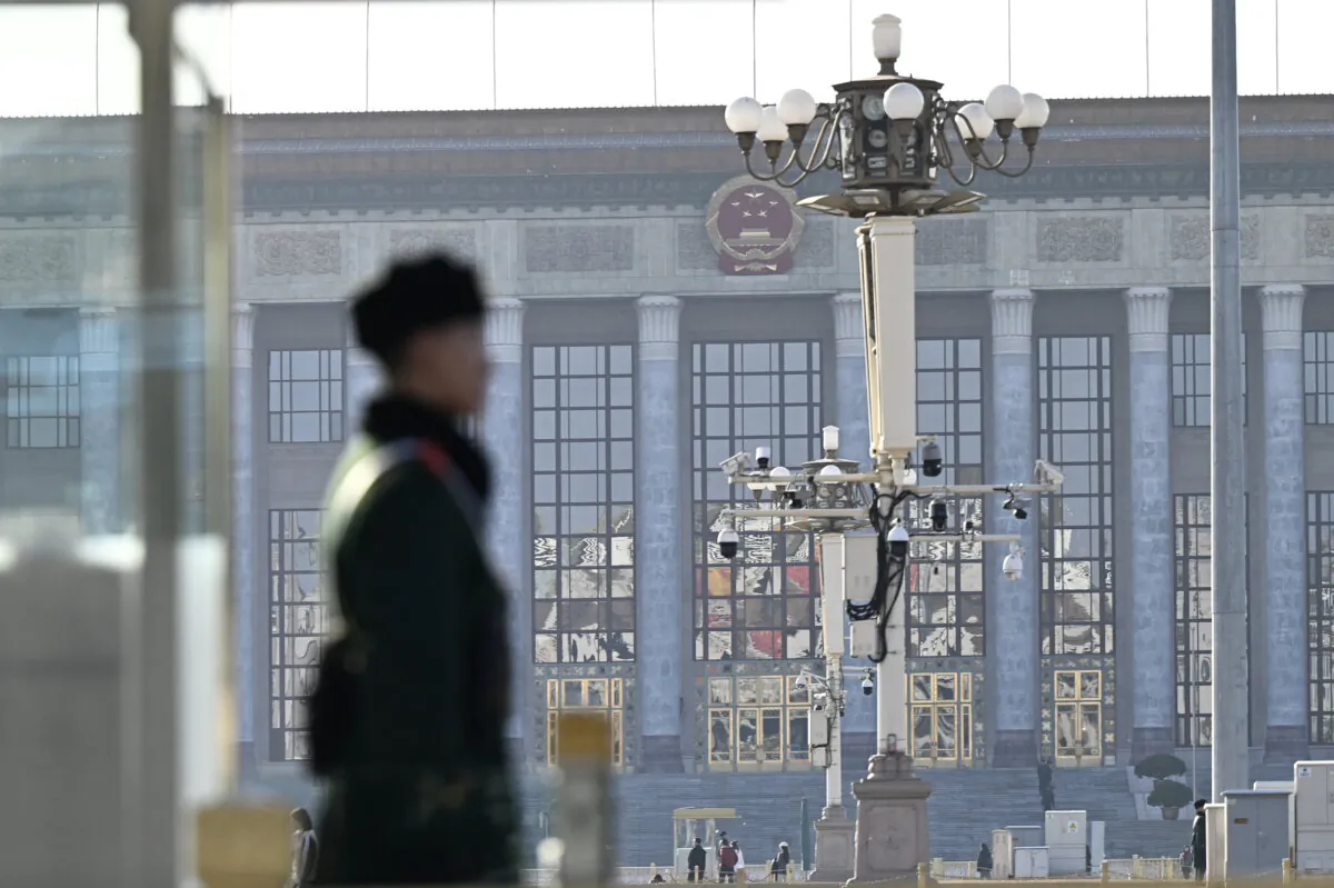 A Chinese paramilitary policeman stands guard outside the Great Hall of the People in Beijing on Feb. 26, 2025. (Pedro Pardo/AFP via Getty Images)