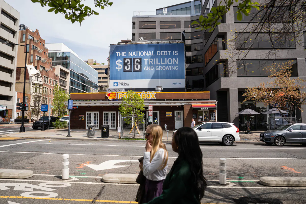 The national debt clock is displayed in Washington on April 14, 2025. (Madalina Vasiliu/The Epoch Times)