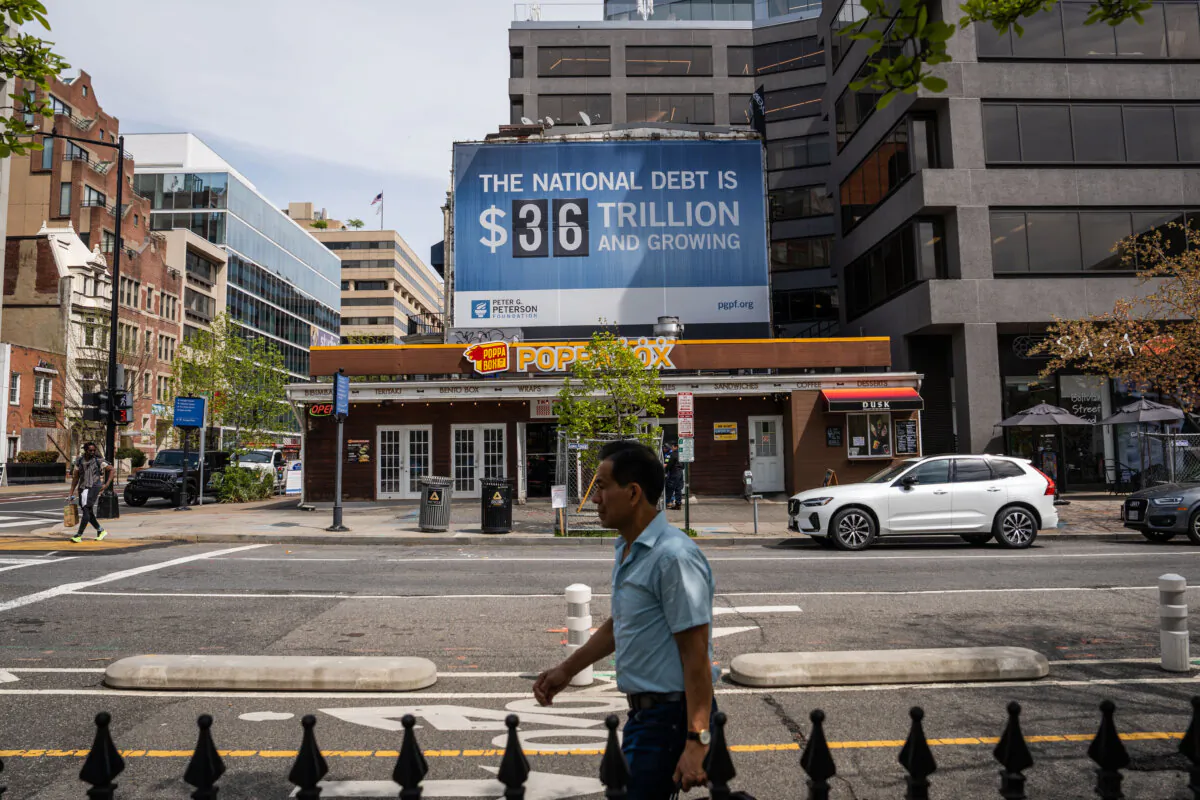 The national debt clock is displayed in Washington on April 14, 2025. (Madalina Vasiliu/The Epoch Times)