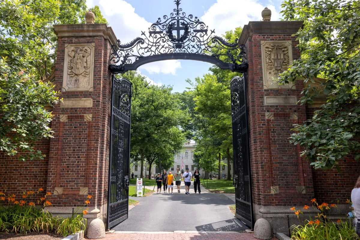 People walk through the gate on Harvard Yard at the Harvard University campus in Cambridge, Mass., on June 29, 2023. (Scott Eisen/Getty Images)