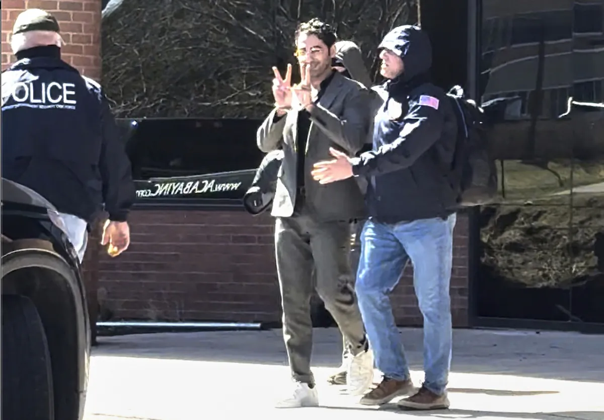 Mohsen Mahdawi, a Palestinian man who led protests against the war in the Gaza Strip as a student at Columbia University, is detained at the Citizenship and Immigration Services office in Colchester, Vt., on April 14, 2025. (Christopher Helali via AP)