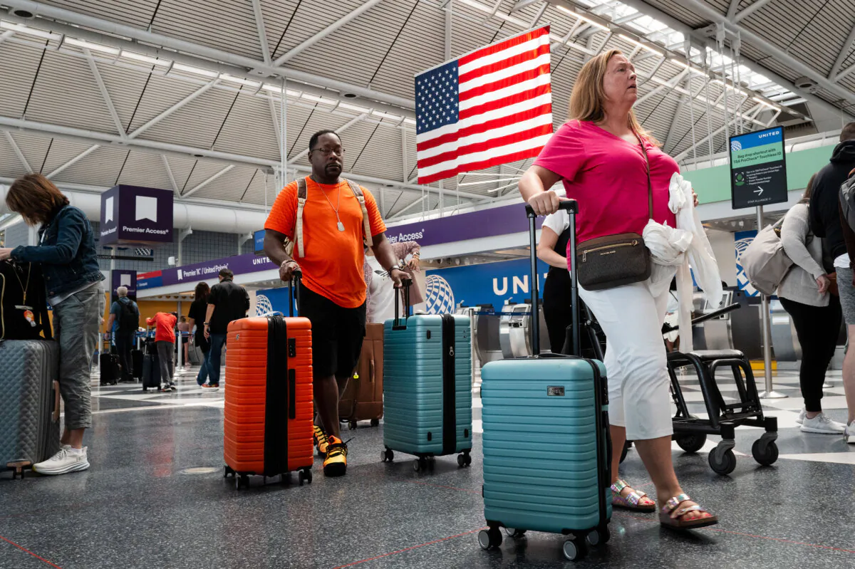 Passengers pass through O'Hare International Airport in Chicago on July 3, 2024. (Scott Olson/Getty Images)