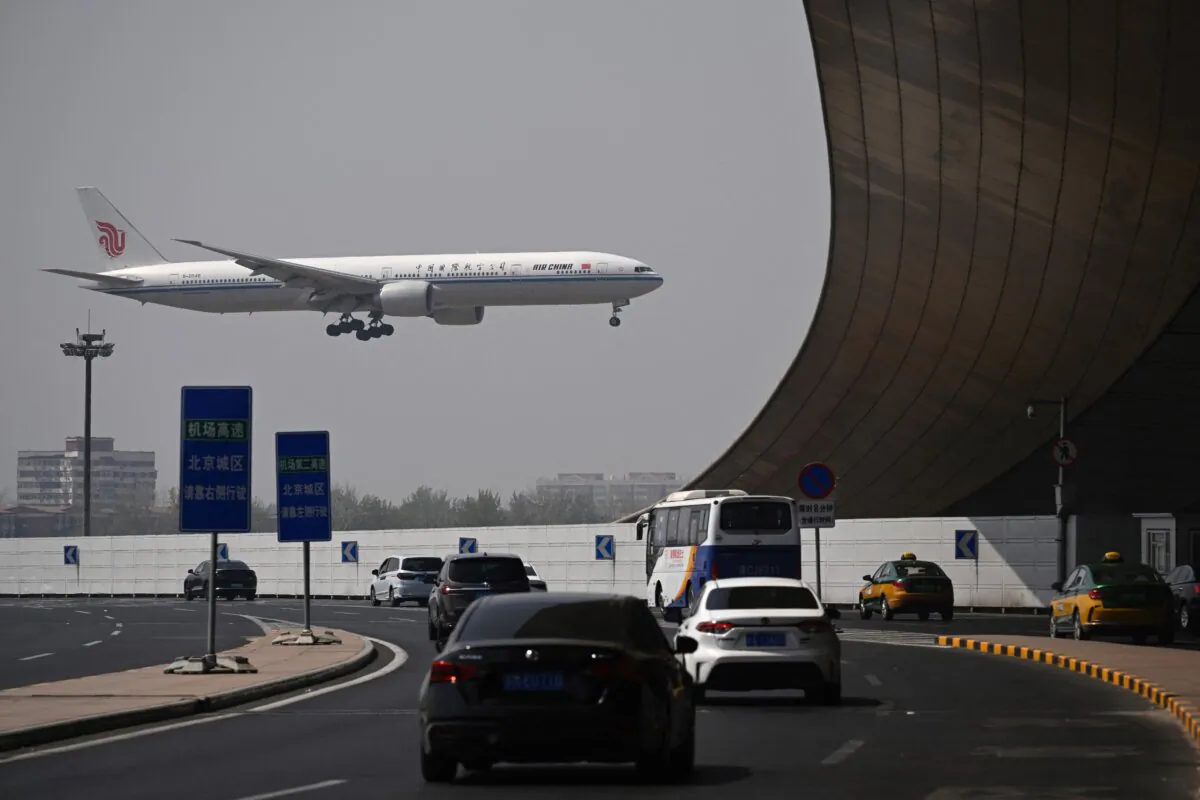An Air China Boeing 777-300 plane lands at Beijing International Airport on April 10, 2025. (Wang Zhao/AFP via Getty Images)
