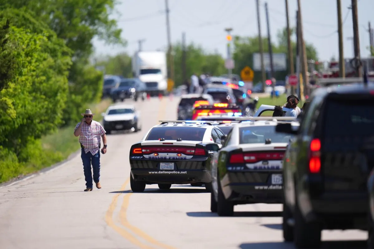 An undercover Texas Highway patrolman arrives to Wilmer-Hutchins High School, where police were responding to a shooting in Dallas, Texas, on April 15, 2025. (Julio Cortez/AP Photo)
