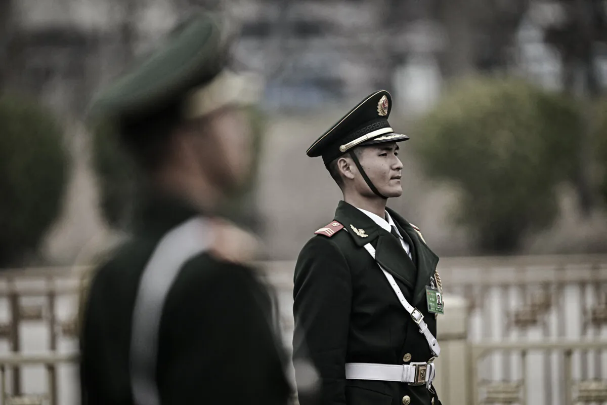 Chinese paramilitary police officers stand guard outside the Great Hall of the People in Beijing on March 11, 2025. (Pedro Pardo/AFP via Getty Images)